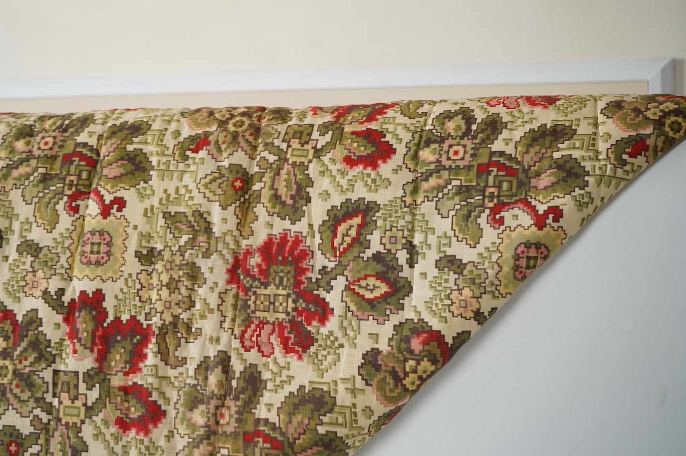 A bold handsome, American, Vermont 1865 (Civil War) ‘basket’ and lattice, hand quilted and piece tied bedcover, with an ornate floral backing. Worked with a plain navy cotton lattice border around central stylised printe